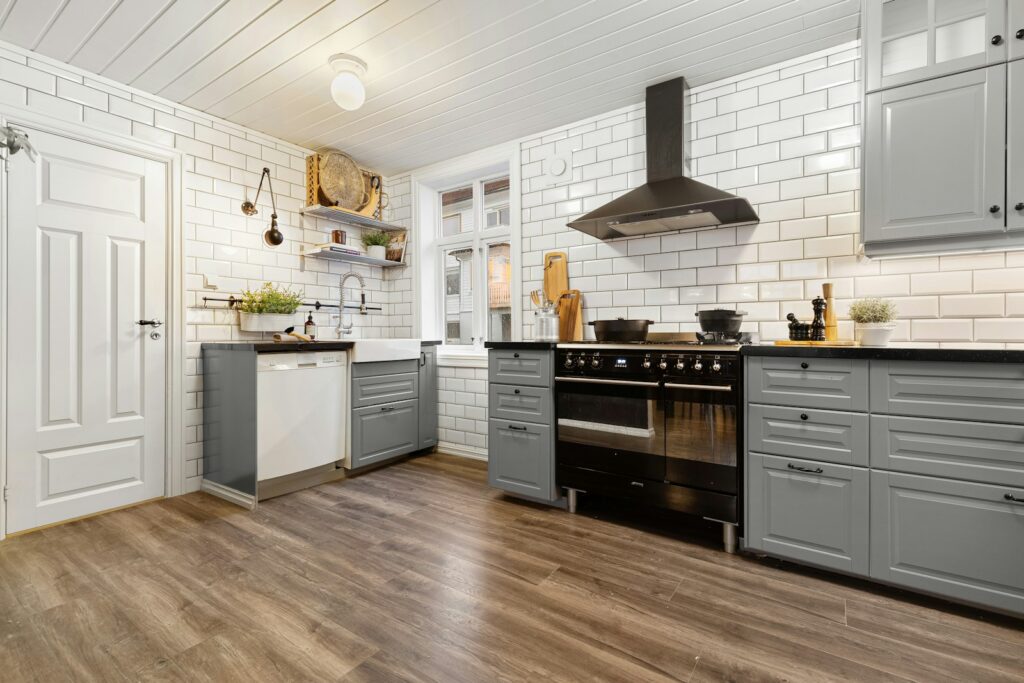 A kitchen with a stove top oven sitting inside of it