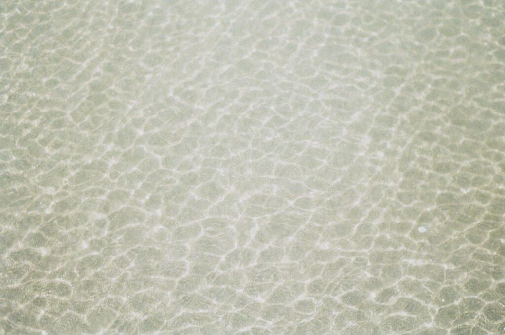 a close up view of the water and sand