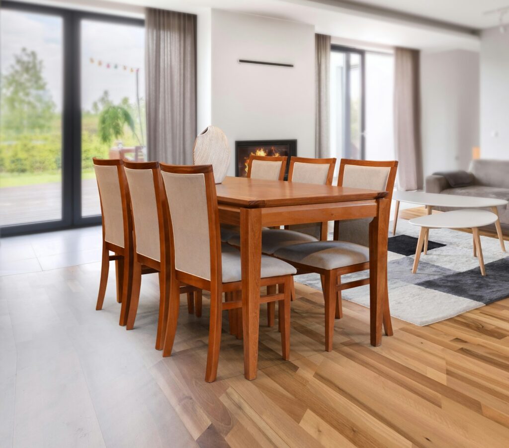 A wooden dining table with chairs in a modern room